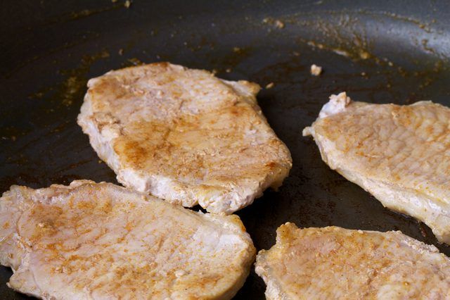 how to bake thin pork chops without drying them out Oven baked pork chops on a sheet pan.