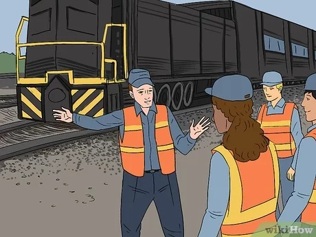 how to become a locomotive conductor Train conductor standing next to passenger train on train station